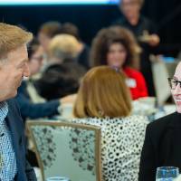 Student with a donor chatting at a table at Scholarship Dinner 2019
